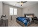 Comfortable bedroom featuring a platform bed, ceiling fan, and neutral-toned walls at 205 Piedmont Alps St, Henderson, NV 89012