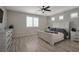 Bright bedroom with a ceiling fan, neutral tones, and plantation shutters at 205 Piedmont Alps St, Henderson, NV 89012