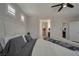 Cozy bedroom with a comfortable bed and ensuite bathroom featuring a walk-in closet at 205 Piedmont Alps St, Henderson, NV 89012