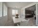 Bright dining room featuring a rustic white table, seating for six, and natural light at 205 Piedmont Alps St, Henderson, NV 89012