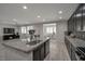 Open-concept kitchen flows into the living and dining areas, perfect for entertaining at 205 Piedmont Alps St, Henderson, NV 89012