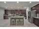 Modern kitchen features a large island, stainless steel appliances, and stylish cabinetry at 205 Piedmont Alps St, Henderson, NV 89012