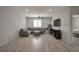 Spacious living room with a gray sectional, large TV, and a ceiling fan at 205 Piedmont Alps St, Henderson, NV 89012