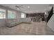 Spacious open-concept living area, connecting the living room with the kitchen and staircase at 205 Piedmont Alps St, Henderson, NV 89012
