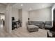 Comfortable living room with a stylish sofa, ottoman, and space for a home office at 205 Piedmont Alps St, Henderson, NV 89012
