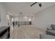 Open loft area with railing overlooking the staircase, ceiling fan, and wood floors at 205 Piedmont Alps St, Henderson, NV 89012