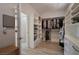 Well-organized walk-in closet with custom shelving, rods, and drawers for optimal storage at 205 Piedmont Alps St, Henderson, NV 89012