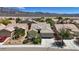 A view of the house showcasing the landscape and mountain views at 2108 Willow Wren Dr, North Las Vegas, NV 89084