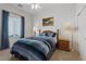 Comfortable bedroom with a queen bed, natural light, and a neutral color scheme at 2108 Willow Wren Dr, North Las Vegas, NV 89084