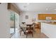 Bright breakfast nook with a sliding glass door and casual dining set at 2108 Willow Wren Dr, North Las Vegas, NV 89084