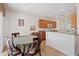 Bright breakfast nook with wooden cabinetry, granite countertops, and a round table set at 2108 Willow Wren Dr, North Las Vegas, NV 89084