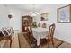 Traditional dining room with elegant table, chairs, and chandelier at 2108 Willow Wren Dr, North Las Vegas, NV 89084