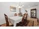 Traditional dining room with elegant table, chairs, and chandelier at 2108 Willow Wren Dr, North Las Vegas, NV 89084