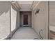Inviting front entryway with a covered porch and a rustic decor accent at 2108 Willow Wren Dr, North Las Vegas, NV 89084