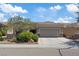Beautiful single-story home with a two-car garage, desert landscaping and a tile roof at 2108 Willow Wren Dr, North Las Vegas, NV 89084