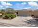Beautiful single-story home with a two-car garage, desert landscaping and a tile roof at 2108 Willow Wren Dr, North Las Vegas, NV 89084