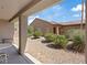 A view of the home's front yard and exterior from the covered patio at 2108 Willow Wren Dr, North Las Vegas, NV 89084