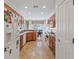 Well-lit kitchen featuring stainless steel appliances, granite countertops, and wooden cabinetry at 2108 Willow Wren Dr, North Las Vegas, NV 89084