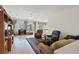 Inviting living room with tile floors, cozy seating, and natural light at 2108 Willow Wren Dr, North Las Vegas, NV 89084