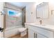 Bathroom featuring a shower-over-tub, white vanity, and gold fixtures at 2180 Palora Ave, Las Vegas, NV 89169