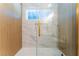 Bathtub with glass enclosure and gold accents at 2180 Palora Ave, Las Vegas, NV 89169