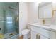 Renovated bathroom featuring glass-enclosed shower with rainfall showerhead and modern vanity at 2180 Palora Ave, Las Vegas, NV 89169