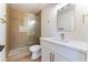 Bathroom featuring a glass shower, white vanity, and gold fixtures at 2180 Palora Ave, Las Vegas, NV 89169