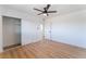 Bedroom featuring wood floors, ceiling fan, and closet at 2180 Palora Ave, Las Vegas, NV 89169