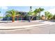 Wide view of home featuring desert landscaping, balcony, and two-car garage at 2180 Palora Ave, Las Vegas, NV 89169