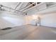 Spacious garage interior with laundry area, featuring ample storage and parking space for vehicles and projects at 2180 Palora Ave, Las Vegas, NV 89169