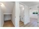 Hallway with an under-stairs storage and a view of half-bath at 2180 Palora Ave, Las Vegas, NV 89169