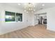 Bright living area with hardwood floors, modern lighting, and an updated eat-in kitchen at 2180 Palora Ave, Las Vegas, NV 89169