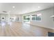 Bright living room boasts hardwood floors, recessed lighting, and sliding glass doors to backyard at 2180 Palora Ave, Las Vegas, NV 89169