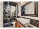 Sleek bathroom with a luxurious walk-in shower, contemporary fixtures, and a stylish vanity area at 2435 Granada Bluff Ct, Las Vegas, NV 89135