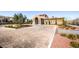 Grand clubhouse entrance with elegant columns and well-maintained landscaping creating a welcoming arrival experience at 2435 Granada Bluff Ct, Las Vegas, NV 89135
