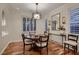 Charming dining room with wood floors and abundant natural light at 2435 Granada Bluff Ct, Las Vegas, NV 89135