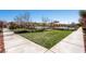 Beautifully landscaped green space with a view of the pool offers a tranquil and scenic environment at 2435 Granada Bluff Ct, Las Vegas, NV 89135