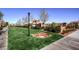 Serene green space with manicured lawns and tasteful landscaping create a picturesque and inviting atmosphere at 2435 Granada Bluff Ct, Las Vegas, NV 89135