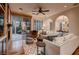 Bright and airy living room with hardwood floors, a fireplace, and sliding glass doors at 2435 Granada Bluff Ct, Las Vegas, NV 89135