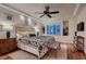 Serene bedroom features a window with shutters, wooden bench, and stylish decor at 2435 Granada Bluff Ct, Las Vegas, NV 89135