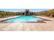 Resort-style pool with ample lounge seating and a well-maintained pool house, perfect for relaxation and recreation at 2435 Granada Bluff Ct, Las Vegas, NV 89135
