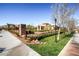 Landscaped street view with manicured lawns and mature trees creates an attractive and well-kept community atmosphere at 2435 Granada Bluff Ct, Las Vegas, NV 89135