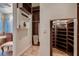 Spacious walk-in closet with custom shelving, hanging racks, and mirrored accents for optimal storage at 2435 Granada Bluff Ct, Las Vegas, NV 89135