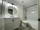 Stylish bathroom with a marble tile surround, modern vanity, and black fixtures at 2606 S Durango Dr # 263, Las Vegas, NV 89117