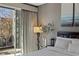 Bedroom featuring neutral walls, and floor to ceiling windows with curtains at 2672 Mystere Ct, Las Vegas, NV 89117