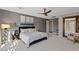 Bedroom featuring neutral walls, a ceiling fan, and a full length mirror at 2672 Mystere Ct, Las Vegas, NV 89117