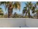View of the city skyline with palm trees in the foreground at 2672 Mystere Ct, Las Vegas, NV 89117