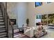 Bright living room with fireplace and large sliding glass doors to the backyard at 2672 Mystere Ct, Las Vegas, NV 89117