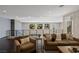Upstairs living area featuring comfortable seating, natural light, and a modern design aesthetic at 2672 Mystere Ct, Las Vegas, NV 89117
