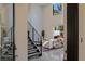 View of the open living room featuring a fireplace, high ceilings, and modern staircase at 2672 Mystere Ct, Las Vegas, NV 89117